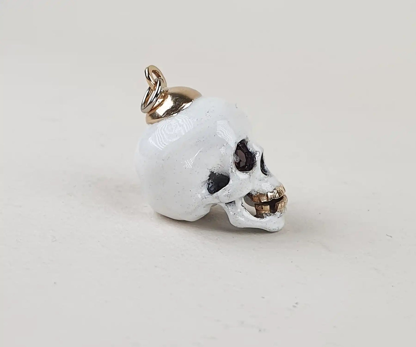 Antique White Enamel Skull Pendant with Garnet Eyes and Gold Teeth
