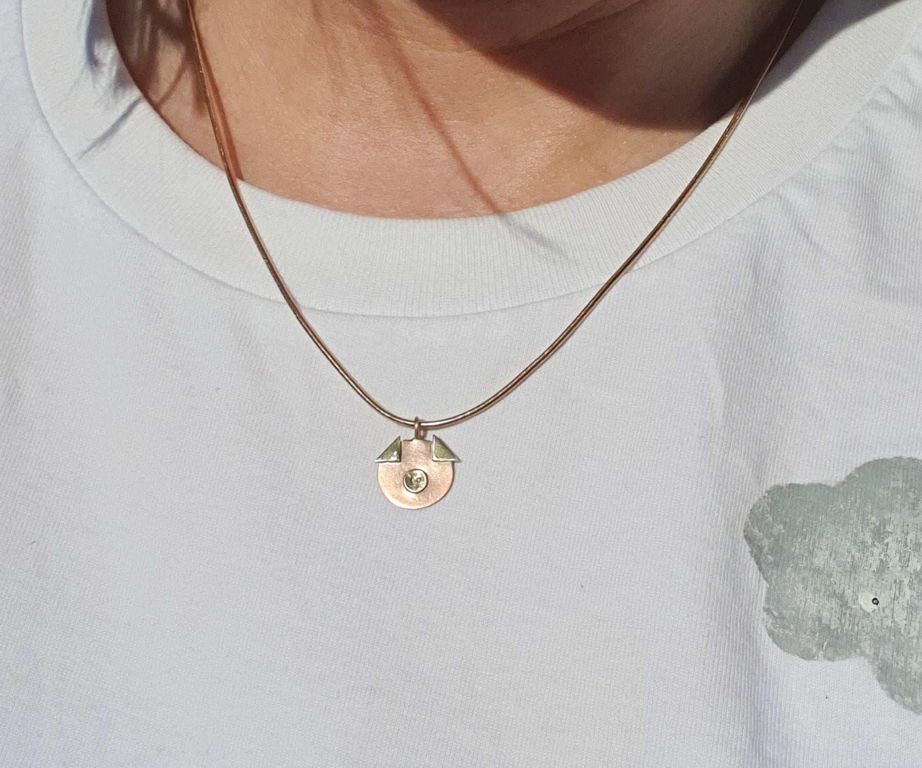 Piglet rose gold pendant on a vintage chain.