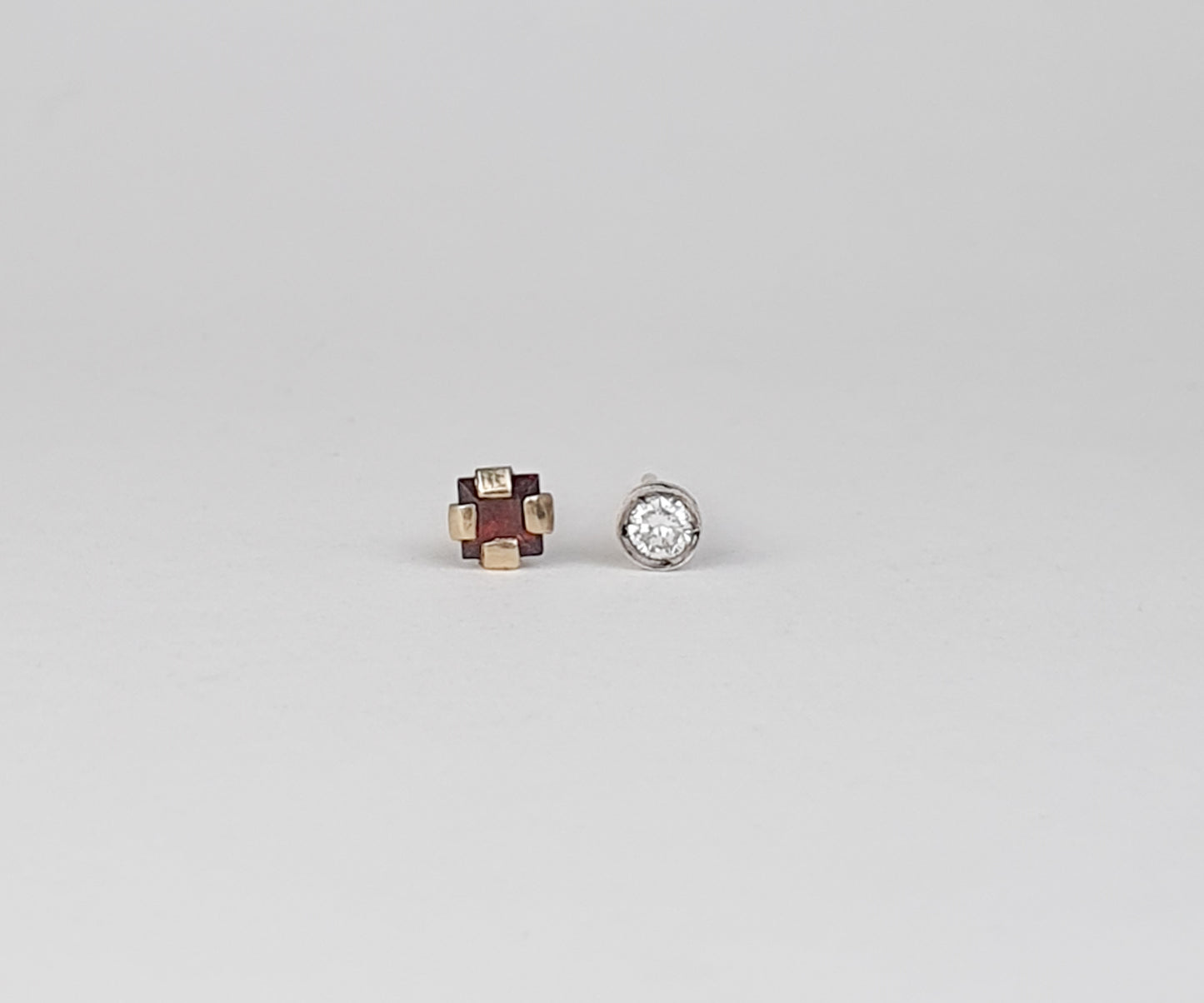 Polar Opposites Diamond and Garnet Stud Earrings