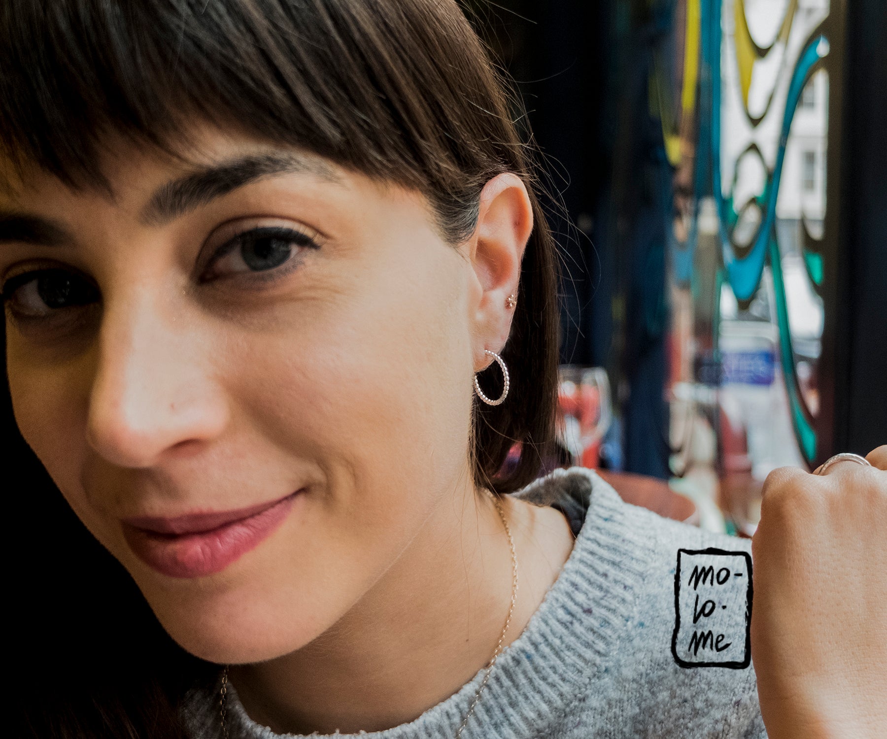 Molo Me Medium Silver Rosary Hoop Earrings on a model Fay