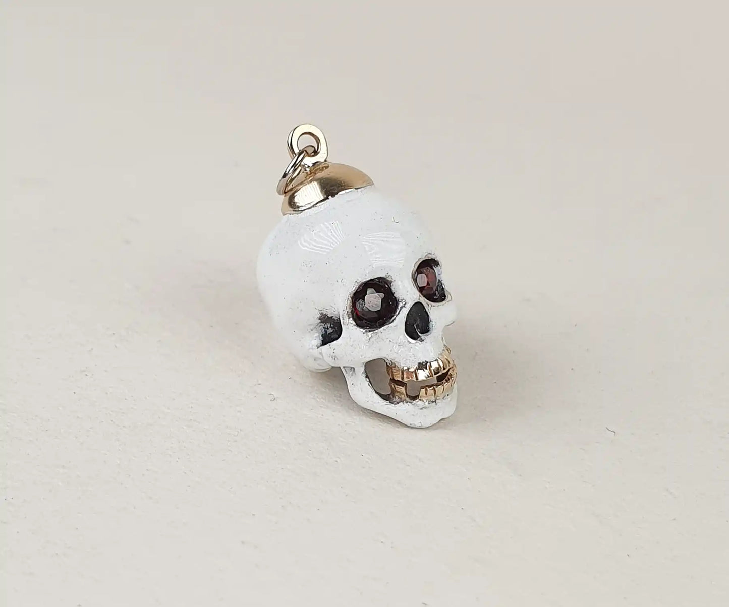 Antique White Enamel Skull Pendant with Garnet Eyes and Gold Teeth