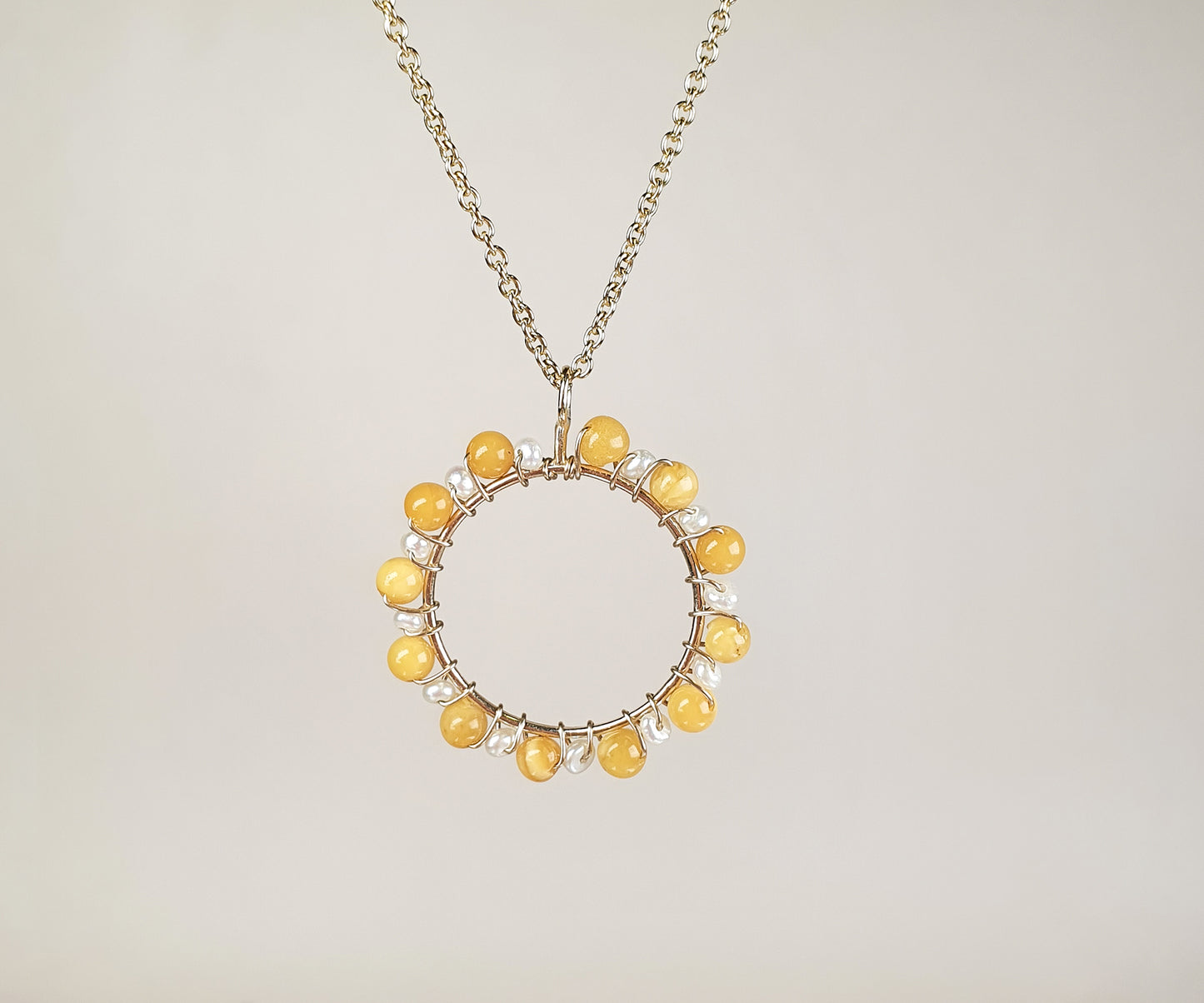 Merry-Go-Round Aga Necklace with Seed Pearls and Amber.