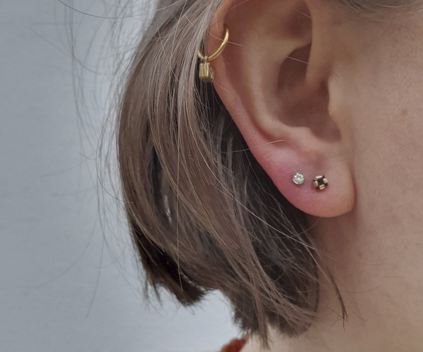 Polar Opposites Diamond and Garnet Stud Earrings