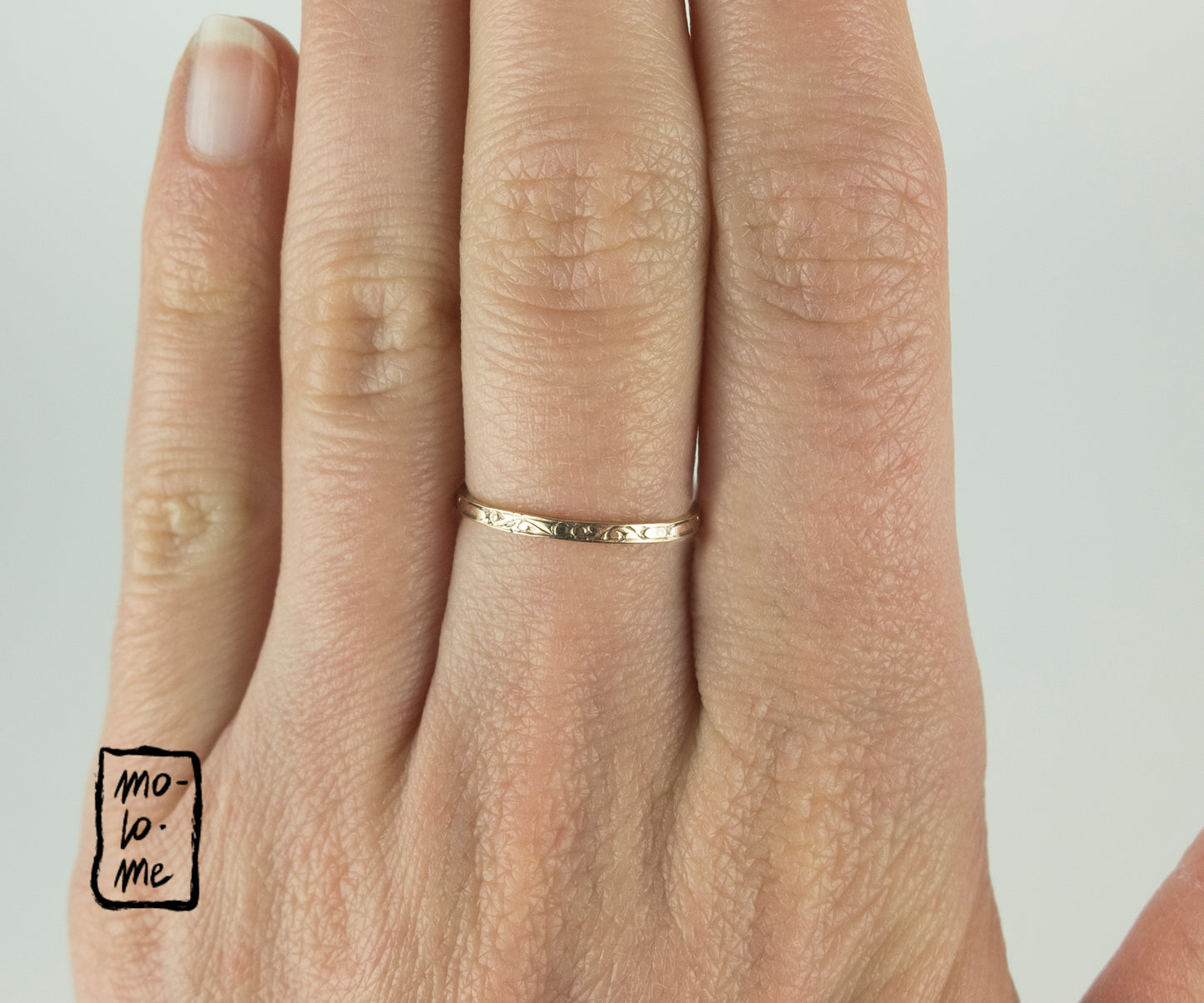 Vintage Skinny Engraved Gold-Plated Stacking Rings by Molo Me on a model
